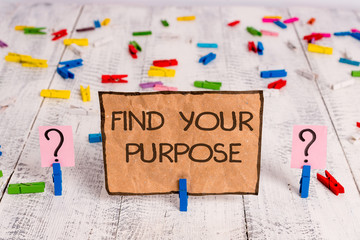 Conceptual hand writing showing Find Your Purpose question. Concept meaning reason for something is done or for which exists Crumbling sheet with paper clips placed on the wooden table