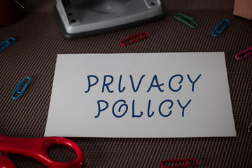 Word writing text Privacy Policy. Business photo showcasing Document that explains how an organization handles clients Scissors and writing equipments plus plain sheet above textured backdrop
