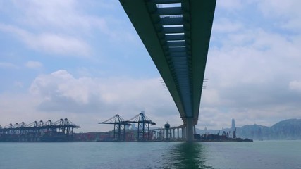 Time lapse of industrial port with containers ship in the harbor at Hong Kong city