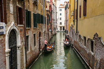 Fototapeta na wymiar VENICE, ITALY - JULY,5: Nice day in the center of Venice, boats, buildings, bridges and channels