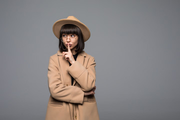 Beautiful young woman in a coat and hat. Fashion autumn winter photo