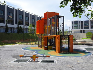 Public children playground with its component. Design with considering safety feature for kids. 