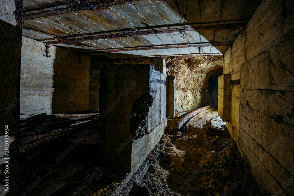 Canvas Prints Dark dirty abandoned uranium mine with rusty remnants of railway - Canvas Prints