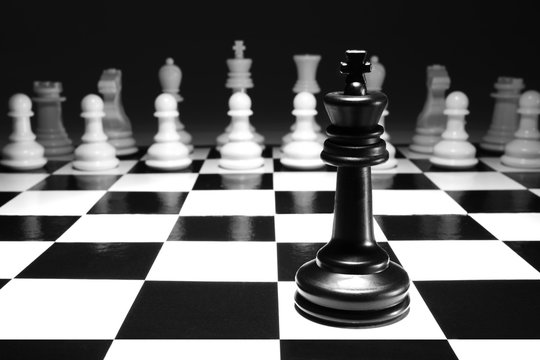 chess black king single alone against white army concept strategy game one selective focus