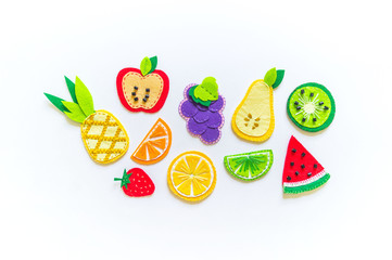Felt fruit. Flat lay. Copy space Summer on a white background.