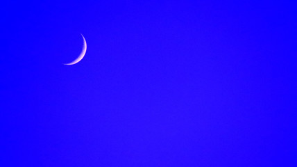 Obraz na płótnie Canvas New moon on blue sky