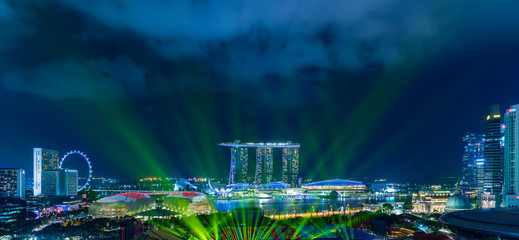 Singapore cityscape with laser illumination at night