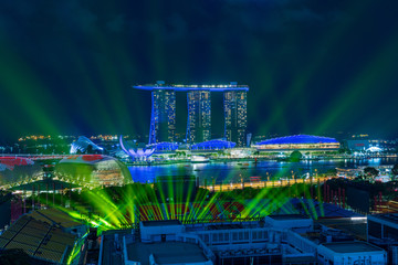 Singapore cityscape with laser illumination at night