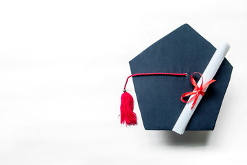 Graduation hats and diploma on the table