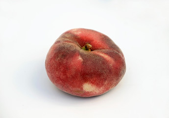 A flat peach isolated on a white background