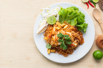 Deliciuos brown rice noodles with shrimp "Pad Thai", One of famous food in Thailand, Top view.