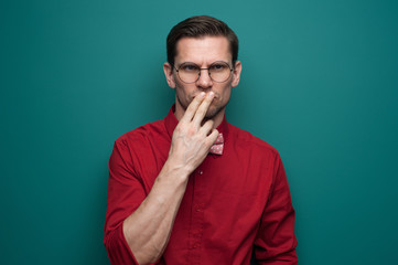 Portrait of a serious doubting man in glasses