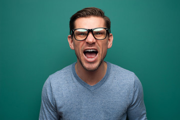 Obraz premium Portrait of an expressive young man in glasses