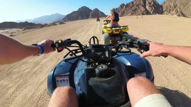 Riding a Quad in the Desert of Egypt. First-person view. Rides ATV bike.
