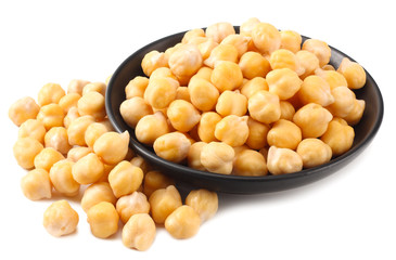 chickpeas in black bowl isolated on white background