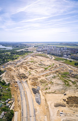 Fototapeta premium aerial panorama of city construction site. blue sky background