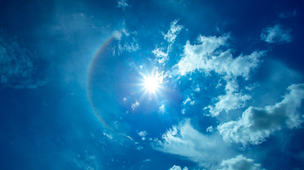 low angle view optical phenomenon Rainbow halo sun flare in the sky