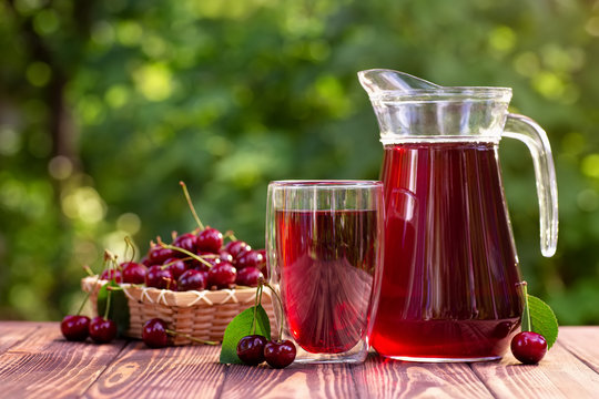 cherry juice in glass and jug