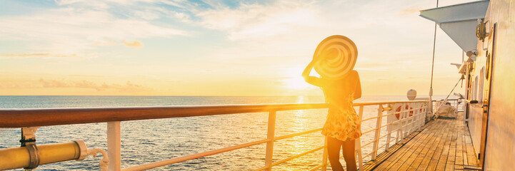 Cruise ship luxury vacation travel elegant woman watching sunset over Caribbean sea on deck boat summer tourist destination panoramic banner. - obrazy, fototapety, plakaty