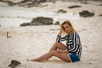 Blonde girl on the beach of the Mexican Caribbean