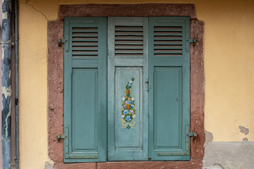 Traditional wooden window cover in Colmar, France