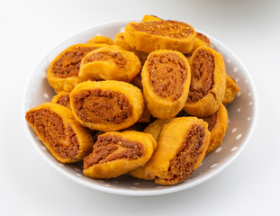 Indian Traditional Spicy Snack Bhakarwadi Also Know as Bakarwadi, Bakarvadi, Bakar Vadi or Bakar Wadi Are Deep Fried Snack Made From Chickpea Flour.