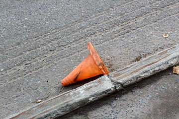 Orange cones for road repair lying on the street