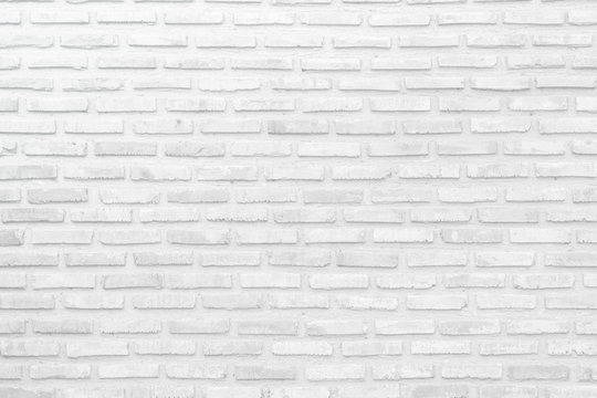 Wall white brick wall texture background in room at subway. Interior rock old clean uneven tile design, horizontal architecture wall.