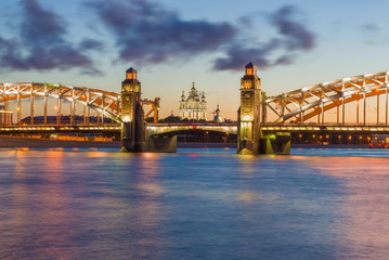 Fototapeta premium Bolsheokhtinsky bridge and old Smolny Cathedral on a white night. Saint-Petersburg, Russia