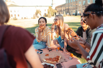 Friends spending evening after their exams together.