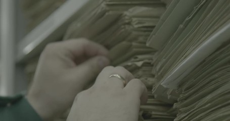 Man looking for documents shot