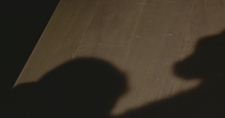 solider is beating a prisoner during hearing