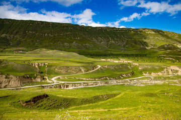 Fototapeta na wymiar Green emerald mountains with terraces for farming