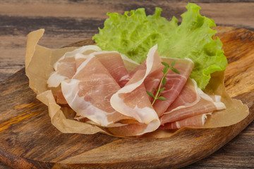 Italian prosciutto pork meat over board