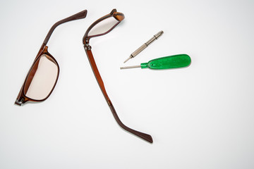 Broken glasses and repair tools
