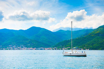 Fototapeta na wymiar Yacht in the Kotor bay, Montenegro. Beautiful summer landscape