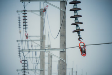 Construction process install aluminum electrical wires with insulators of high voltage distribution...