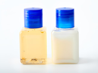 Shampoo and shower gel on a white background. Hotel cosmetic bottles isolated on white. Mini bottle set