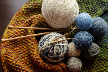 Wool yarn for knitting. A bunch of colorful skeins of wool yarn close-up.