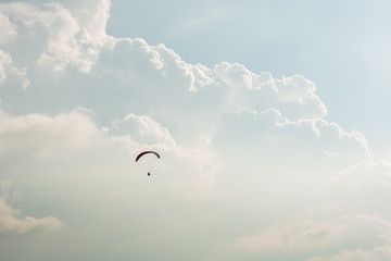 Fototapeta na wymiar colorful paragliding over blue sky