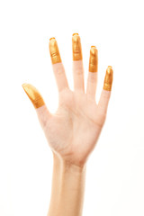Hands in gold paint. Golden fingers. Female hand is showing numbers isolated on white background. Sign language. Hand numbers