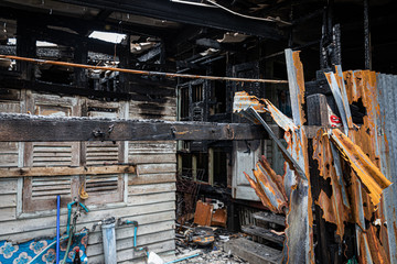 The crowded old wooden houses is on fire, Conflagration, The ruins of a fire