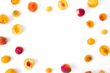 Fototapeta na wymiar Ripe peaches with apricotes on white background. Food frame. Top view. Flat lay