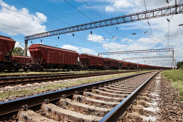 Fototapeta na wymiar Industrial railway - wagons, rails and infrastructure, electric power supply, Cargo transportation and shipping concept.