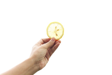 Women's hand of fresh lemon yellow on a white background.