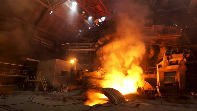 Metallurgical production, equipment at the hot workshop at the plant, heavy industry, engineering. Stock footage. View inside of the steelmaking factory.