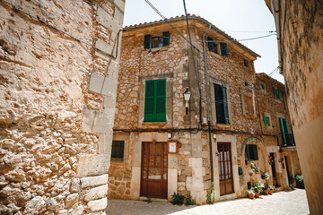 Traditional street in old town in Spain. Street of Valldemossa old mediterranean village, landmark of Majorca, Spain island