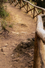 Fototapeta na wymiar footpath earthen tourist path wooden fence mountain extreme walk camping