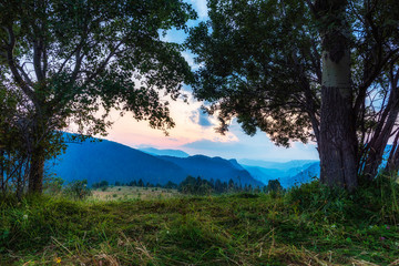 Obraz na płótnie Canvas Mountain valley during sunrise. Natural summer landscape