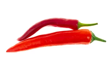 Fotobehang long curved pod of chili pepper horizontal vegetables on white background isolated © Kai Beercrafter